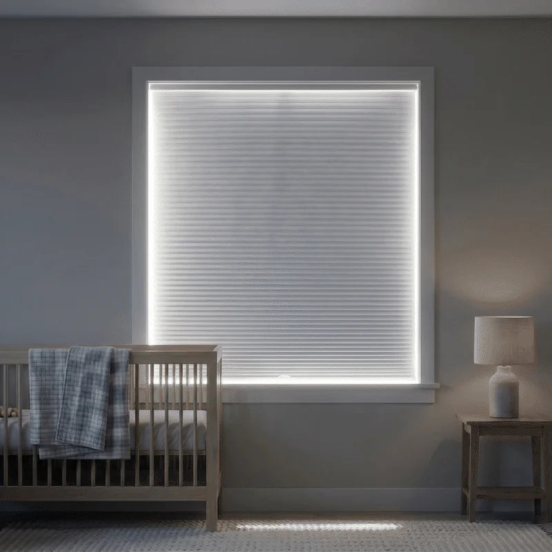 A nursery window showing light around a blind, followed by a darkened room